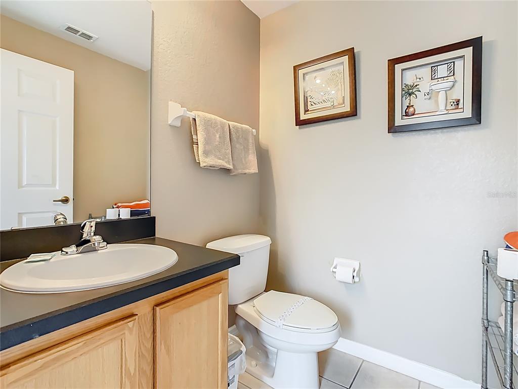 334 Cadiz Loop Davenport, FL 33837 - Photo 27 of 63 a bathroom with a sink and a toilet