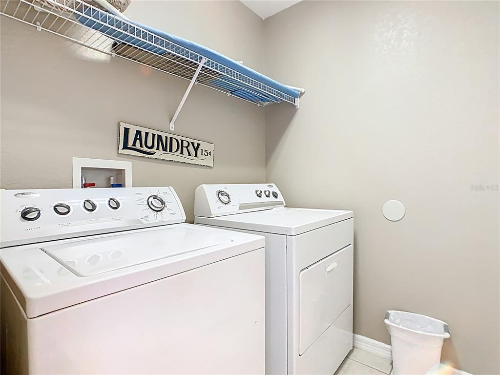 334 Cadiz Loop Davenport, FL 33837 - Photo 50 of 63 a utility room with dryer and washer