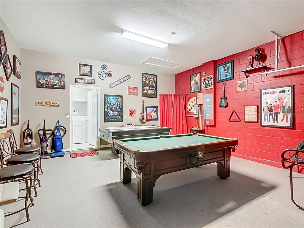 334 Cadiz Loop Davenport, FL 33837 - Photo 53 of 63 a room with pool table and windows