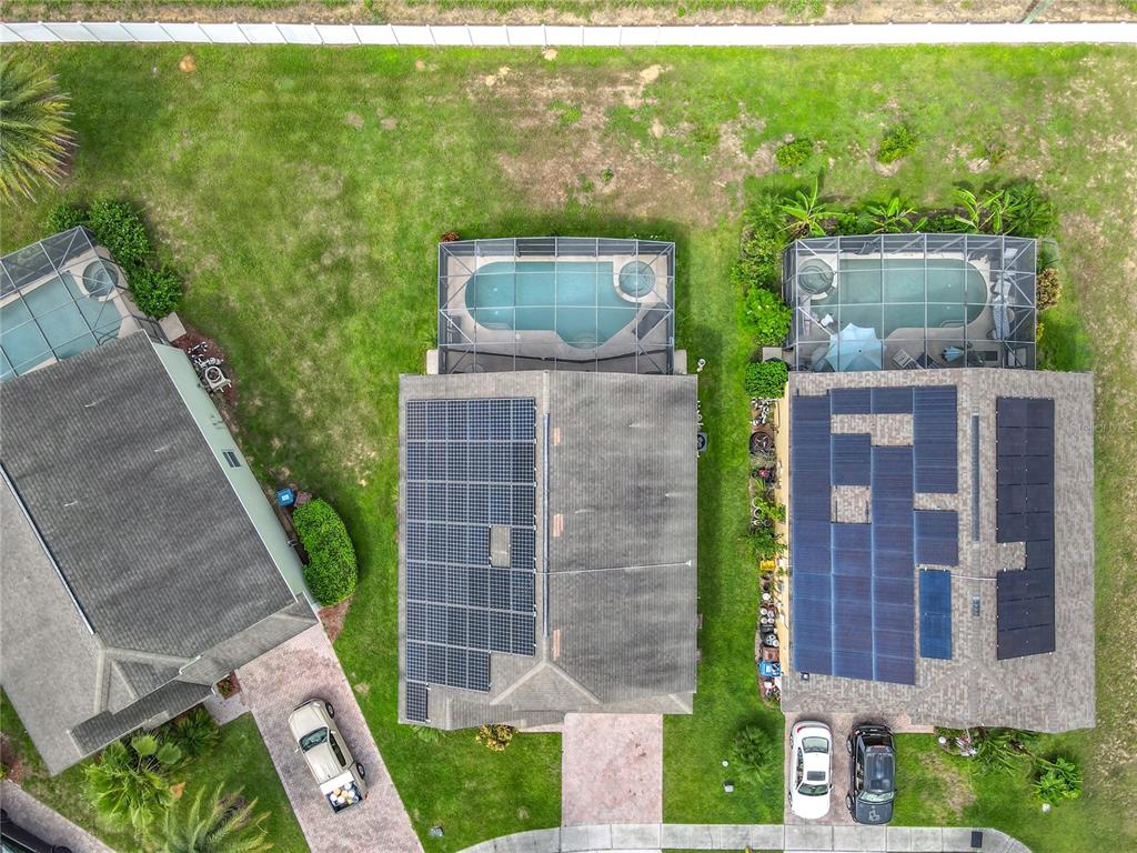 334 Cadiz Loop Davenport, FL 33837 - Photo 59 of 63 a aerial view of a house with a yard and potted plants