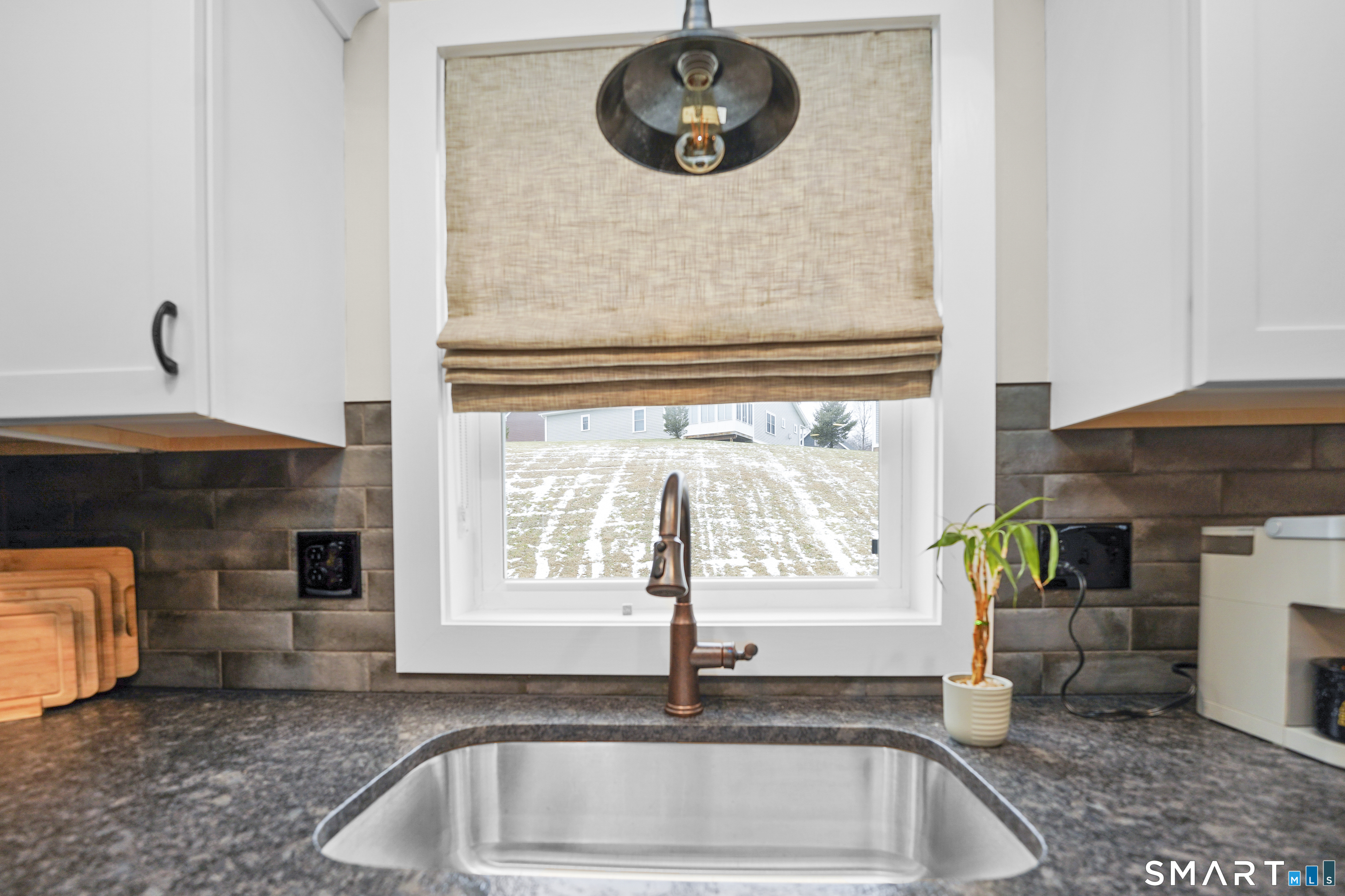 42 Chapman Chase, Unit 42 Windsor Locks, CT 06096 - Photo 12 of 38 a kitchen with a sink and a stove