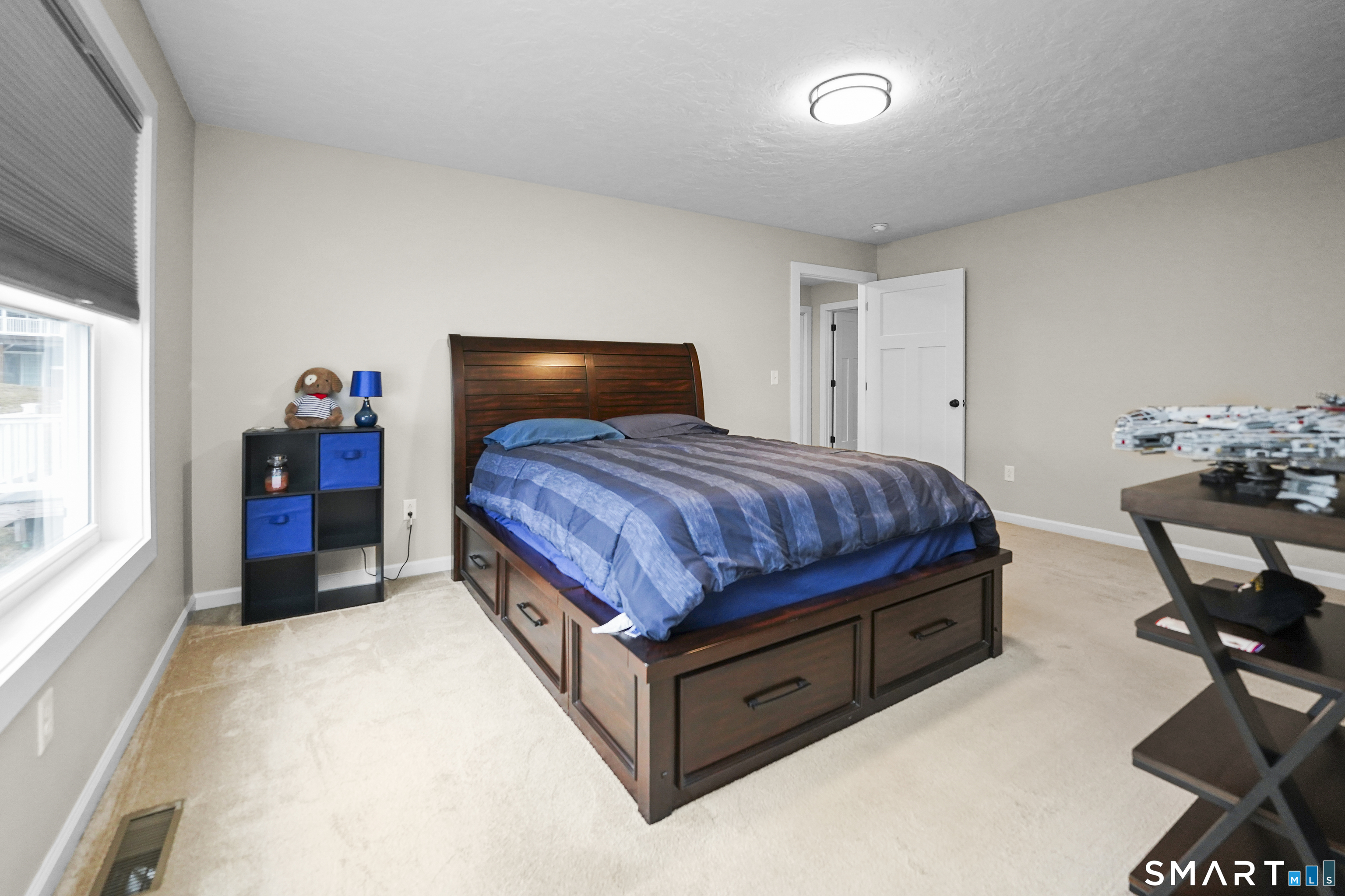 42 Chapman Chase, Unit 42 Windsor Locks, CT 06096 - Photo 18 of 38 a bedroom with a bed and furniture