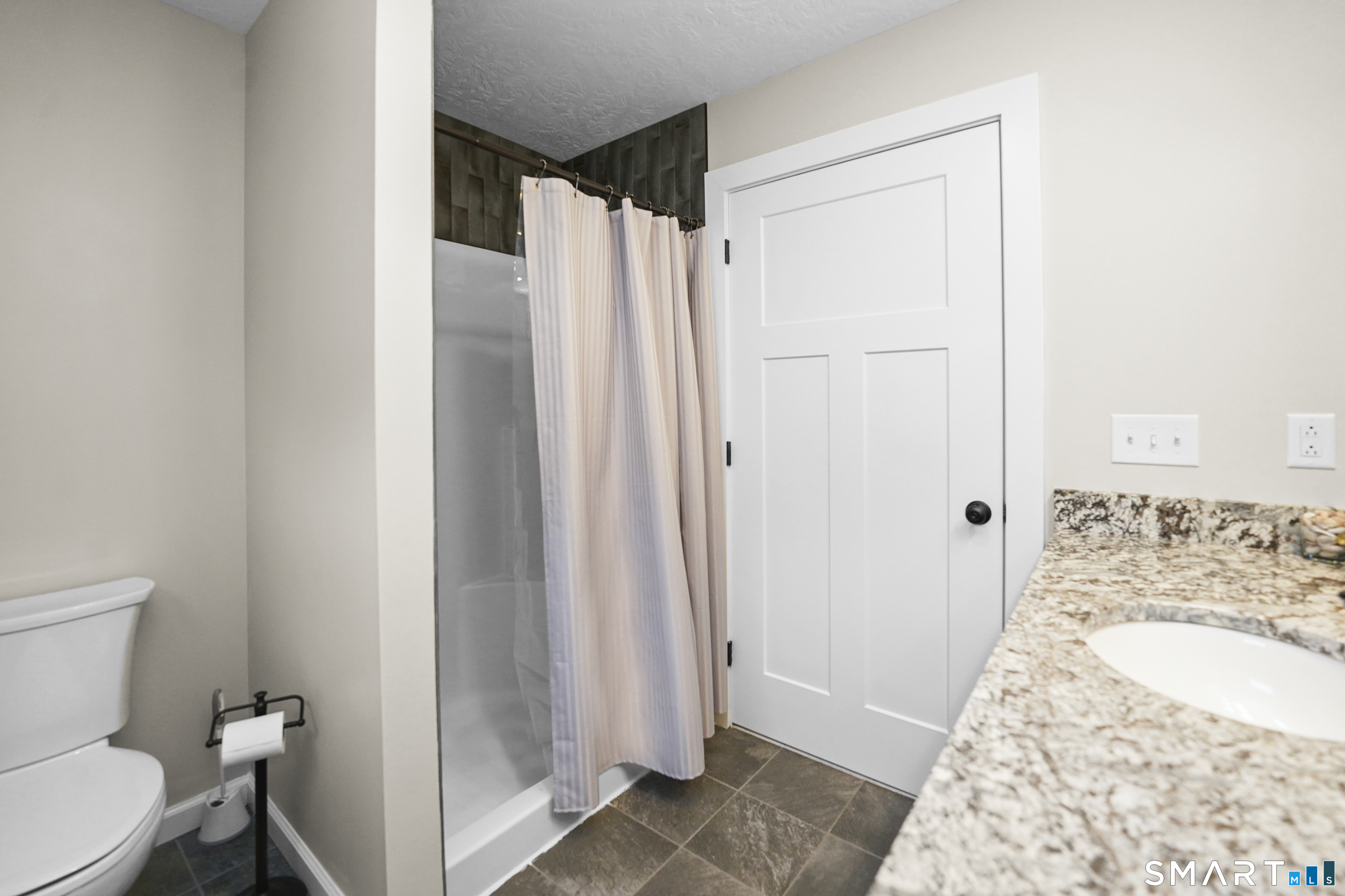 42 Chapman Chase, Unit 42 Windsor Locks, CT 06096 - Photo 21 of 38 a bathroom with a sink toilet and shower