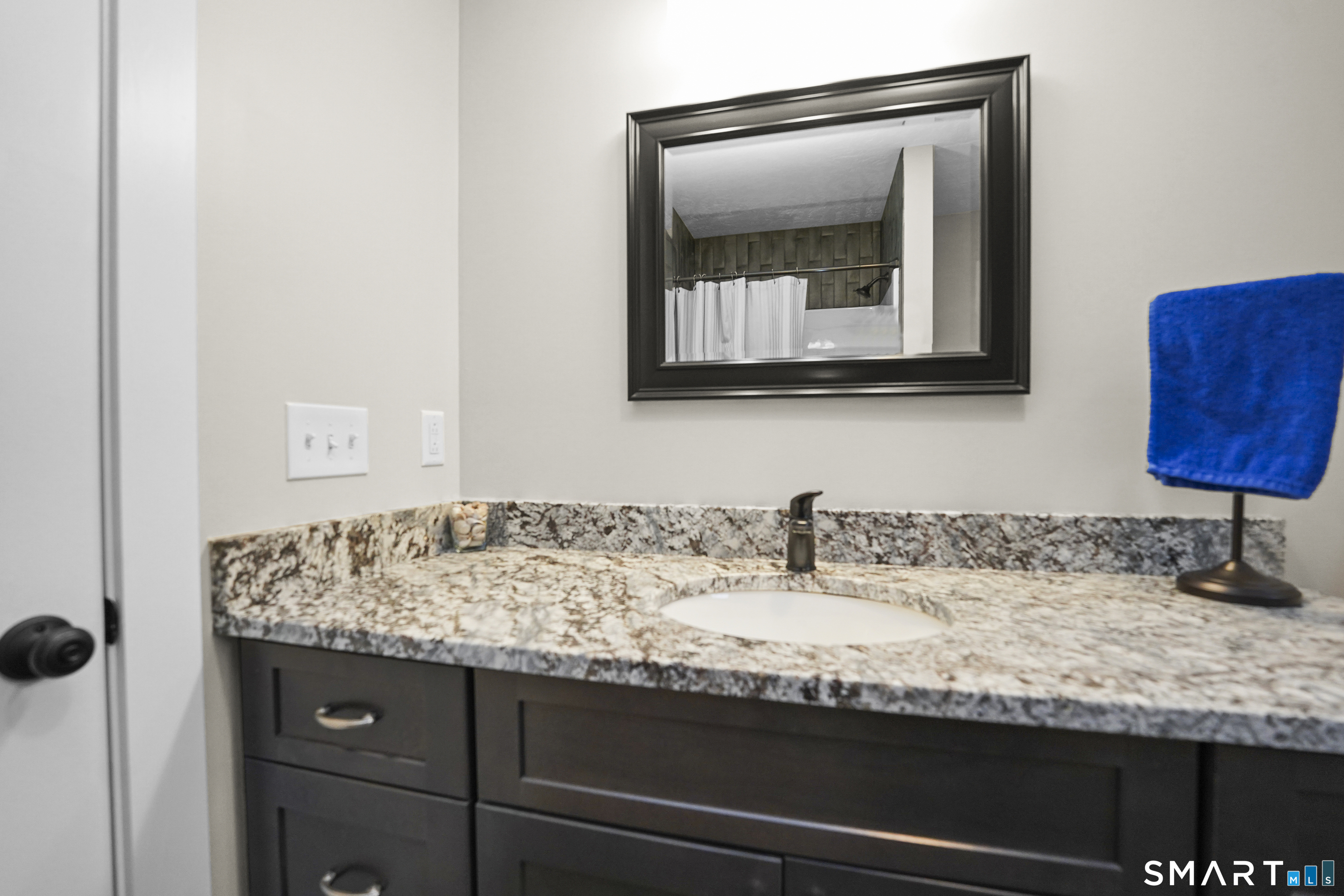 42 Chapman Chase, Unit 42 Windsor Locks, CT 06096 - Photo 22 of 38 a bathroom with a sink and a mirror