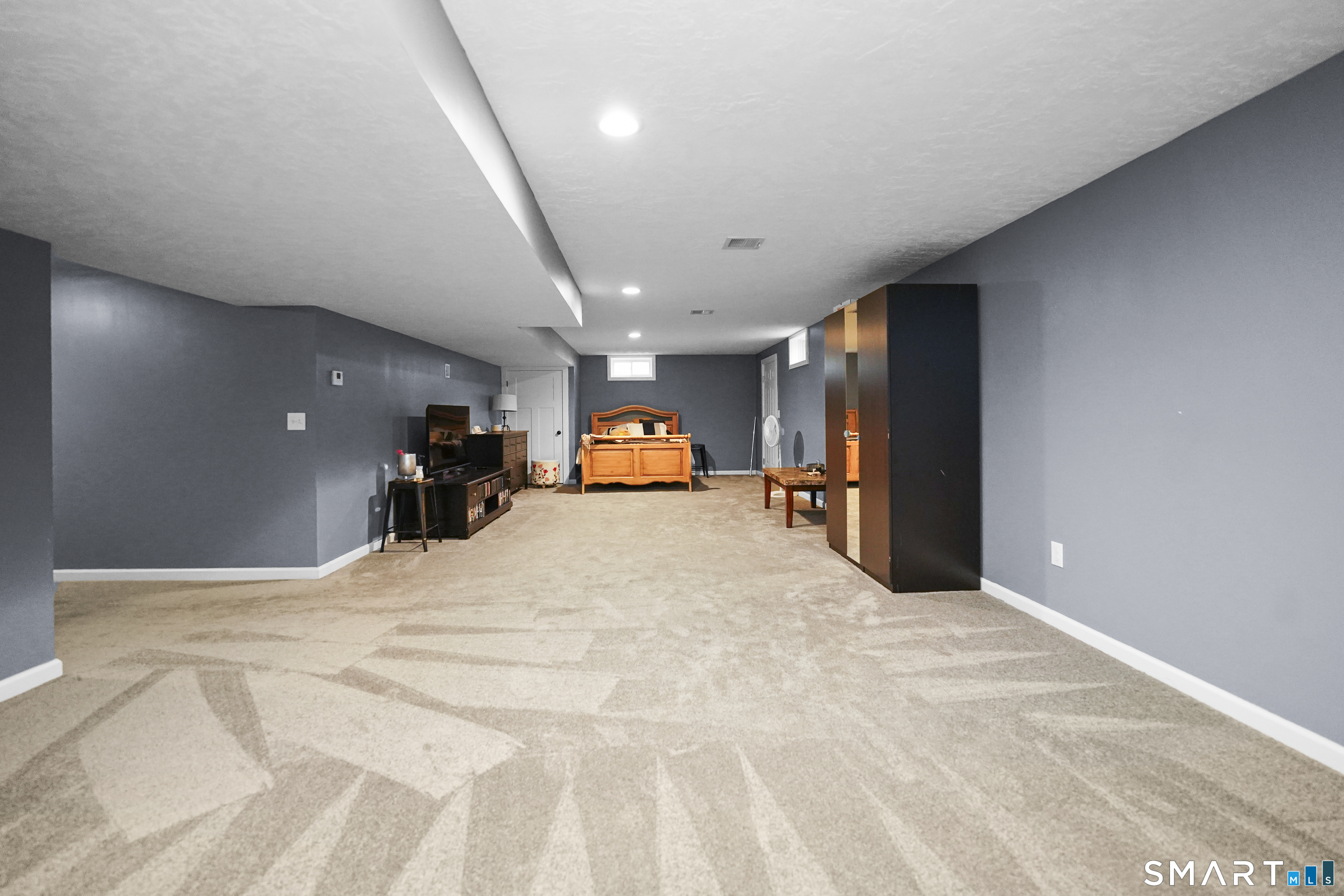 42 Chapman Chase, Unit 42 Windsor Locks, CT 06096 - Photo 32 of 38 a view of livingroom with a flat screen tv