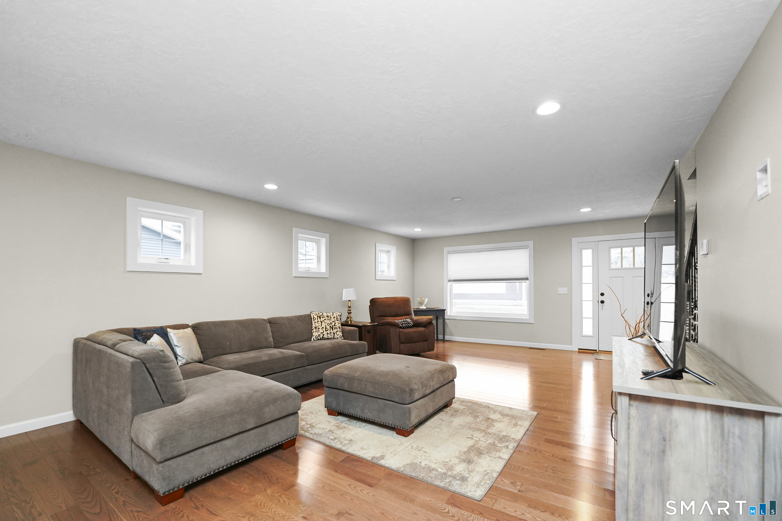 42 Chapman Chase, Unit 42 Windsor Locks, CT 06096 - Photo 7 of 38 a living room with furniture and a couch