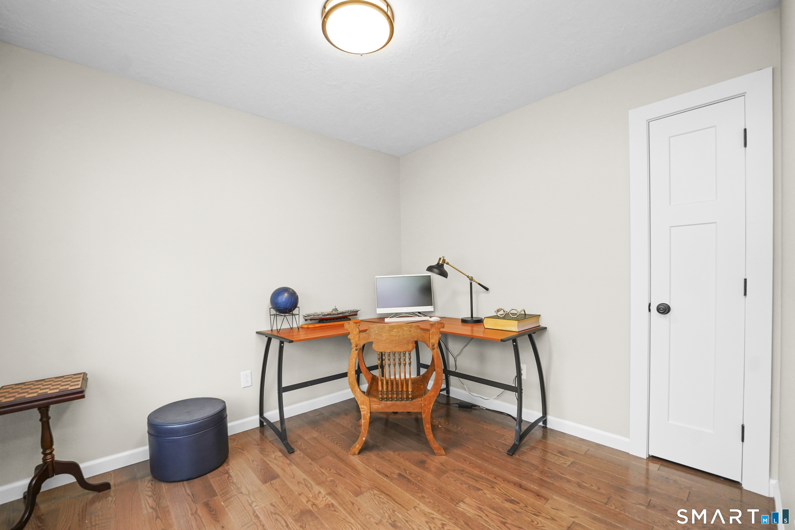 42 Chapman Chase, Unit 42 Windsor Locks, CT 06096 - Photo 8 of 38 a dining room with furniture and a wooden floor