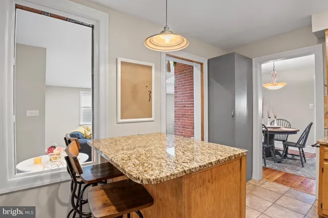 a kitchen with a table and chairs