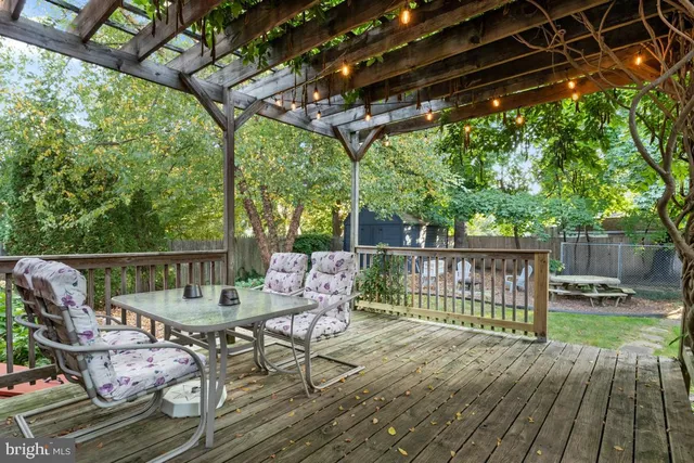a view of a chair and tables in the patio