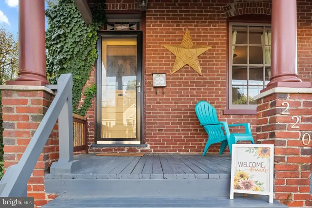 a view of a chair and table on the deck