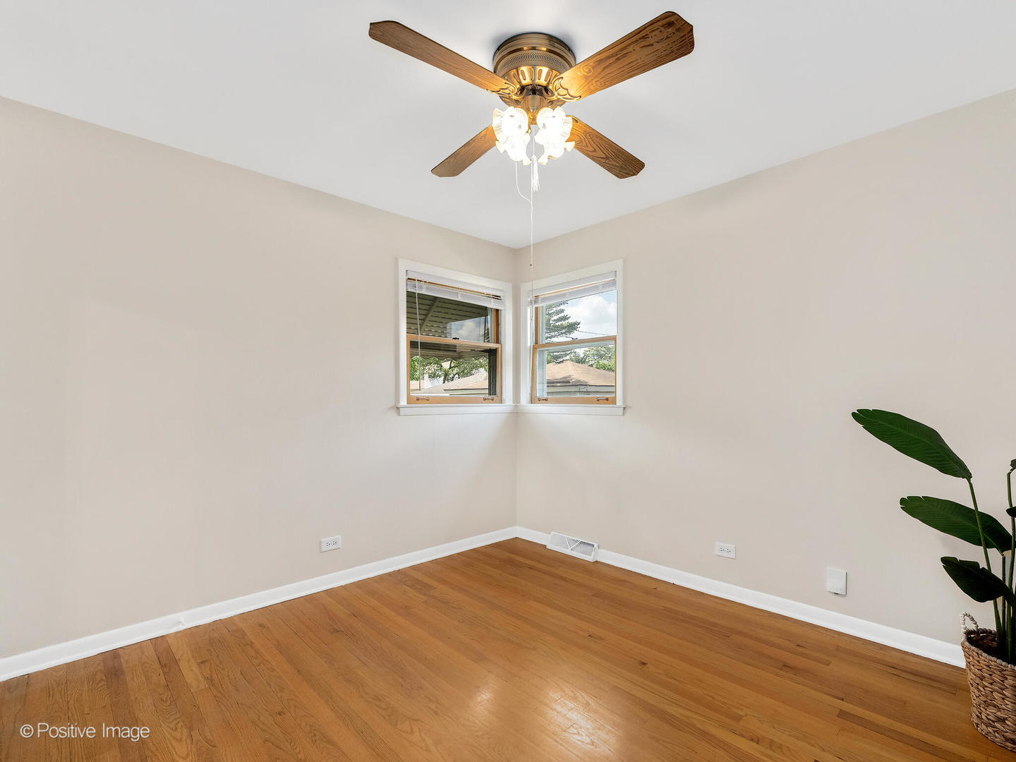 4220 Maple Avenue Brookfield, IL 60513 - Photo 12 of 22 wooden floor in an empty room with a window