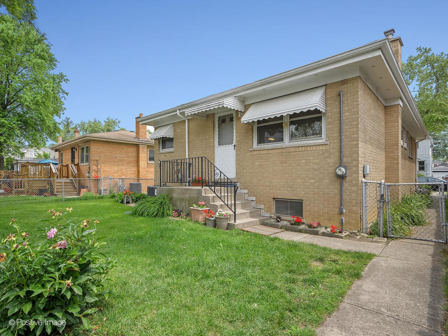 4220 Maple Avenue Brookfield, IL 60513 - Photo 21 of 22 a front view of house with yard and green space