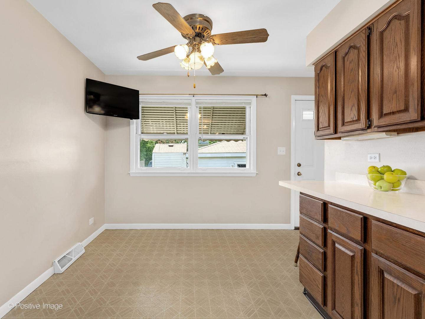 4220 Maple Avenue Brookfield, IL 60513 - Photo 6 of 22 a kitchen with stainless steel appliances a stove a microwave and cabinets