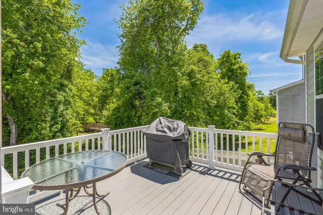 a view of a chair and table on the wooden floor