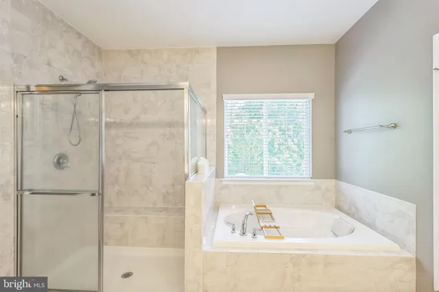 a white bath tub sitting next to a window