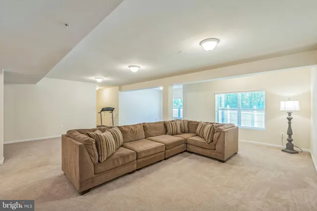 a living room with a couch and a window