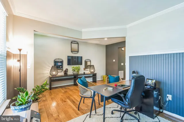 a workspace with furniture and wooden floor