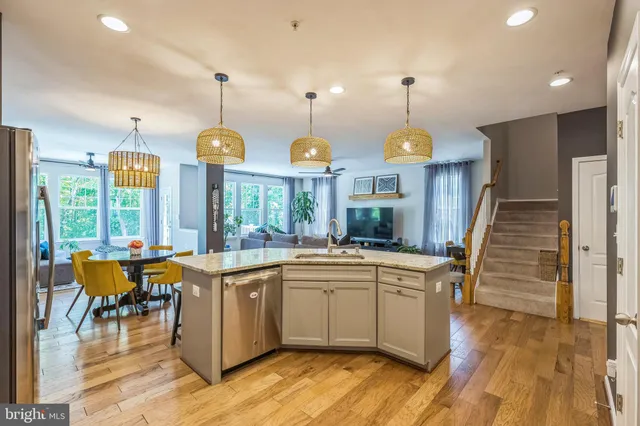 a large kitchen with lots of counter space and a sink