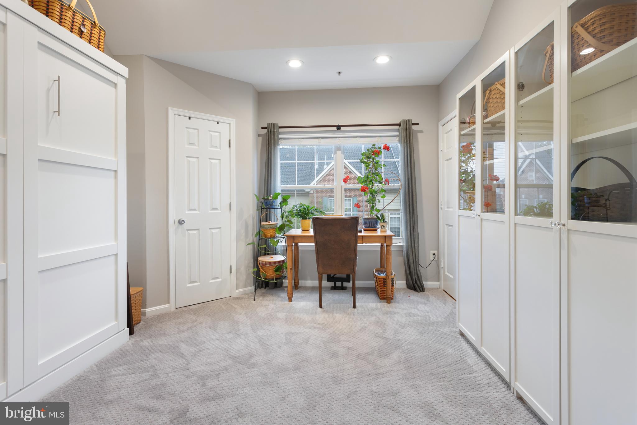 11834 Breton Court, Unit 22B Reston, VA 20191 - Photo 12 of 43 Murphy bed (queen size) and book shelves convey!