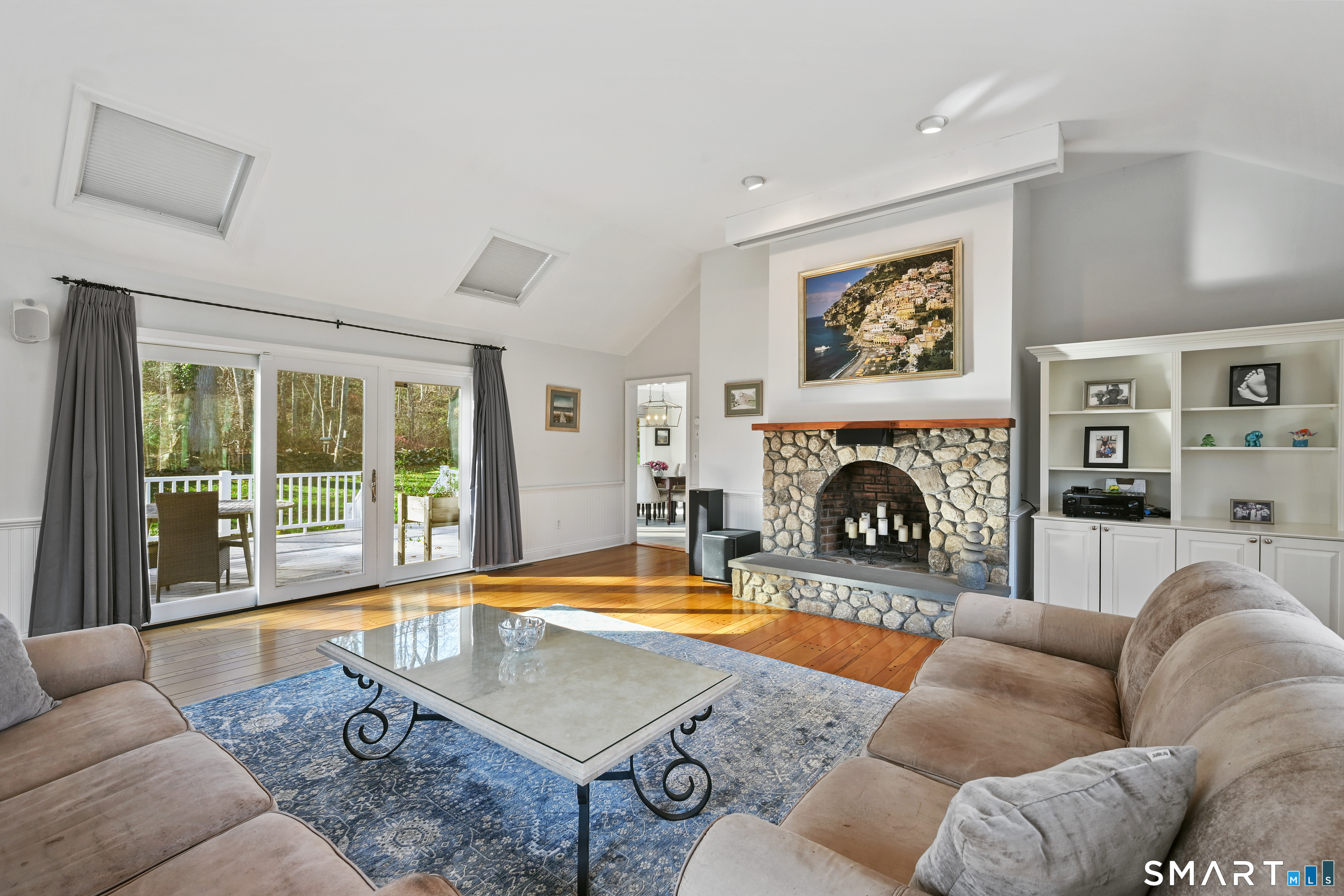 84 Delaware Road Easton, CT 06612 - Photo 12 of 39 a living room with furniture large window and a fireplace