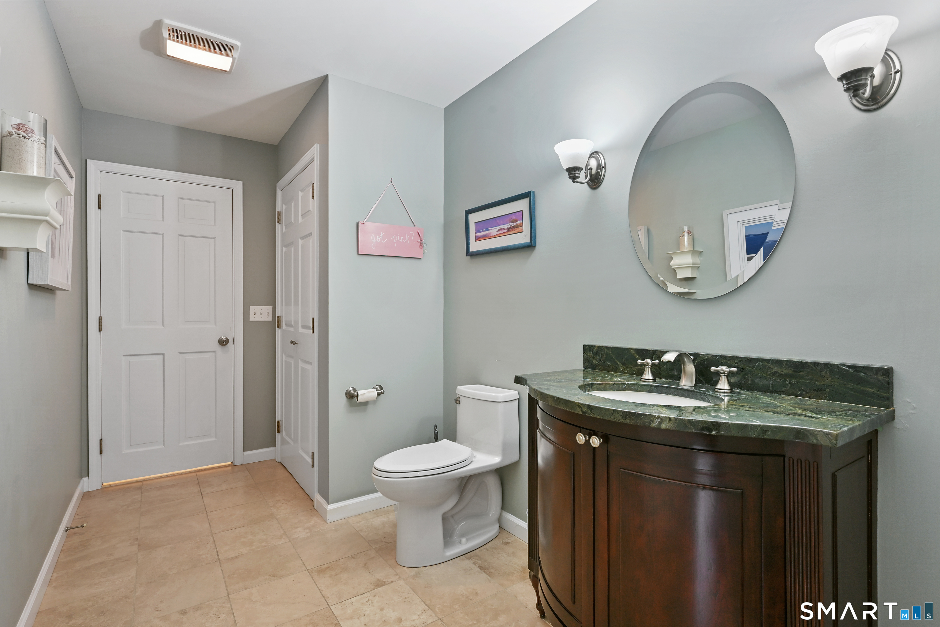 84 Delaware Road Easton, CT 06612 - Photo 14 of 39 a bathroom with a granite countertop sink a toilet and a mirror