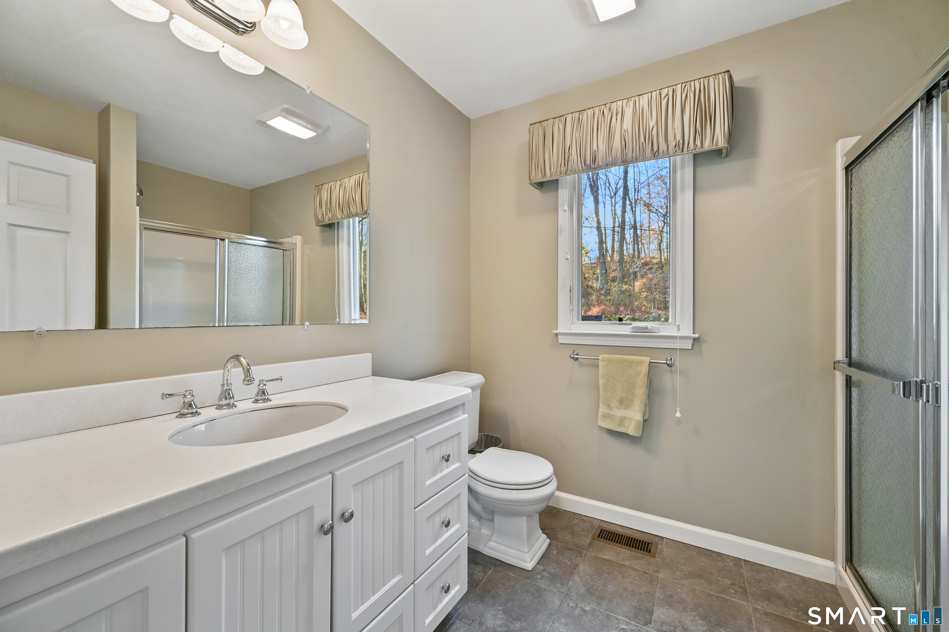 84 Delaware Road Easton, CT 06612 - Photo 16 of 39 a bathroom with a sink a toilet and shower