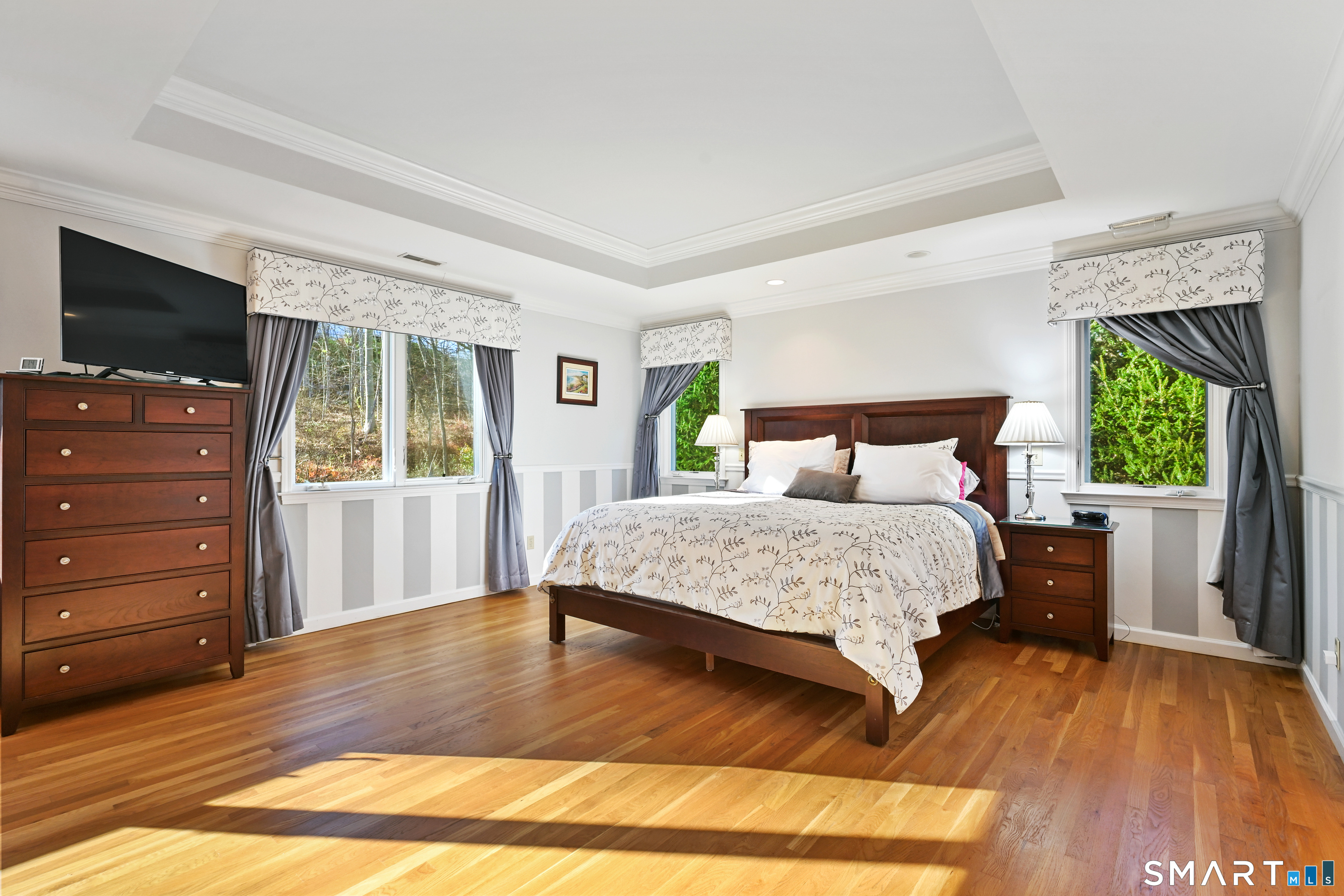 84 Delaware Road Easton, CT 06612 - Photo 18 of 39 a bedroom with a bed and a flat screen tv