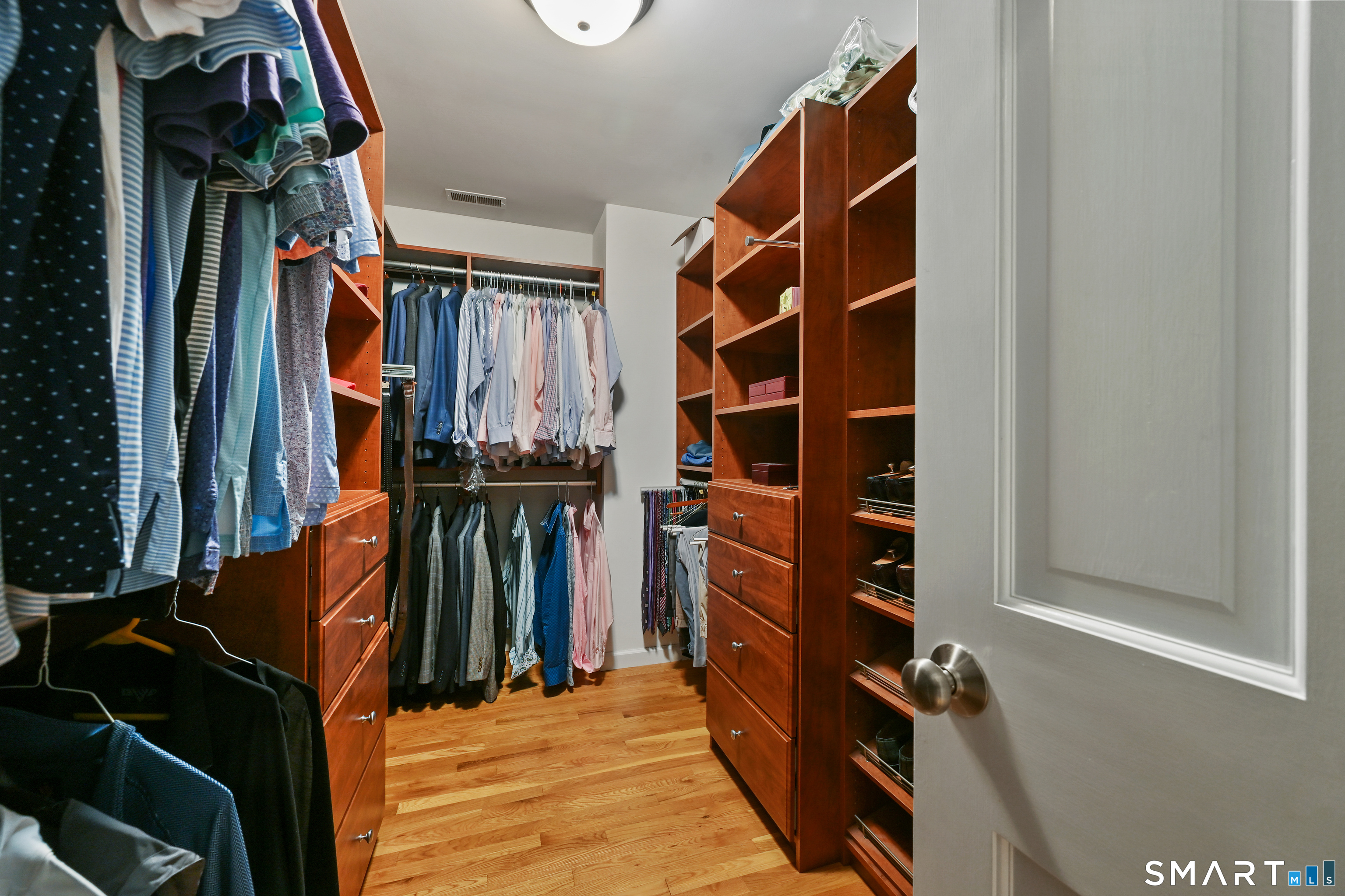 84 Delaware Road Easton, CT 06612 - Photo 21 of 39 a view of walk in closet with clothes and shoes