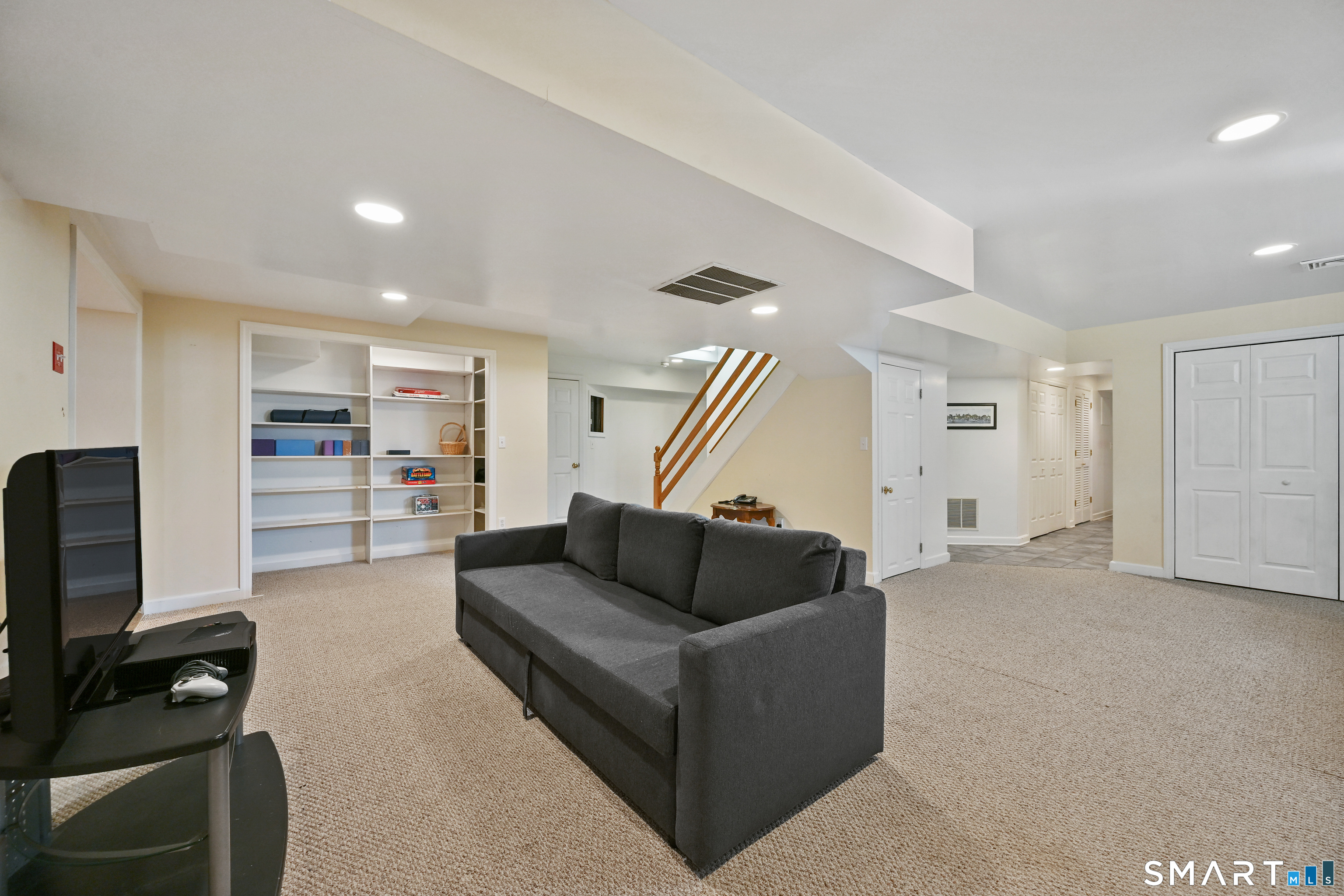 84 Delaware Road Easton, CT 06612 - Photo 30 of 39 a living room with furniture and a flat screen tv