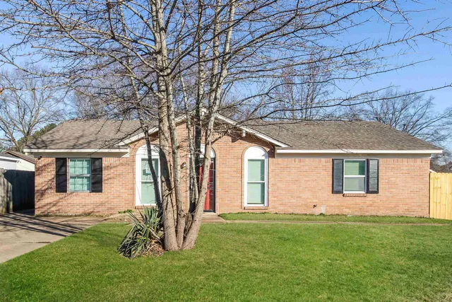 front view of house with a yard