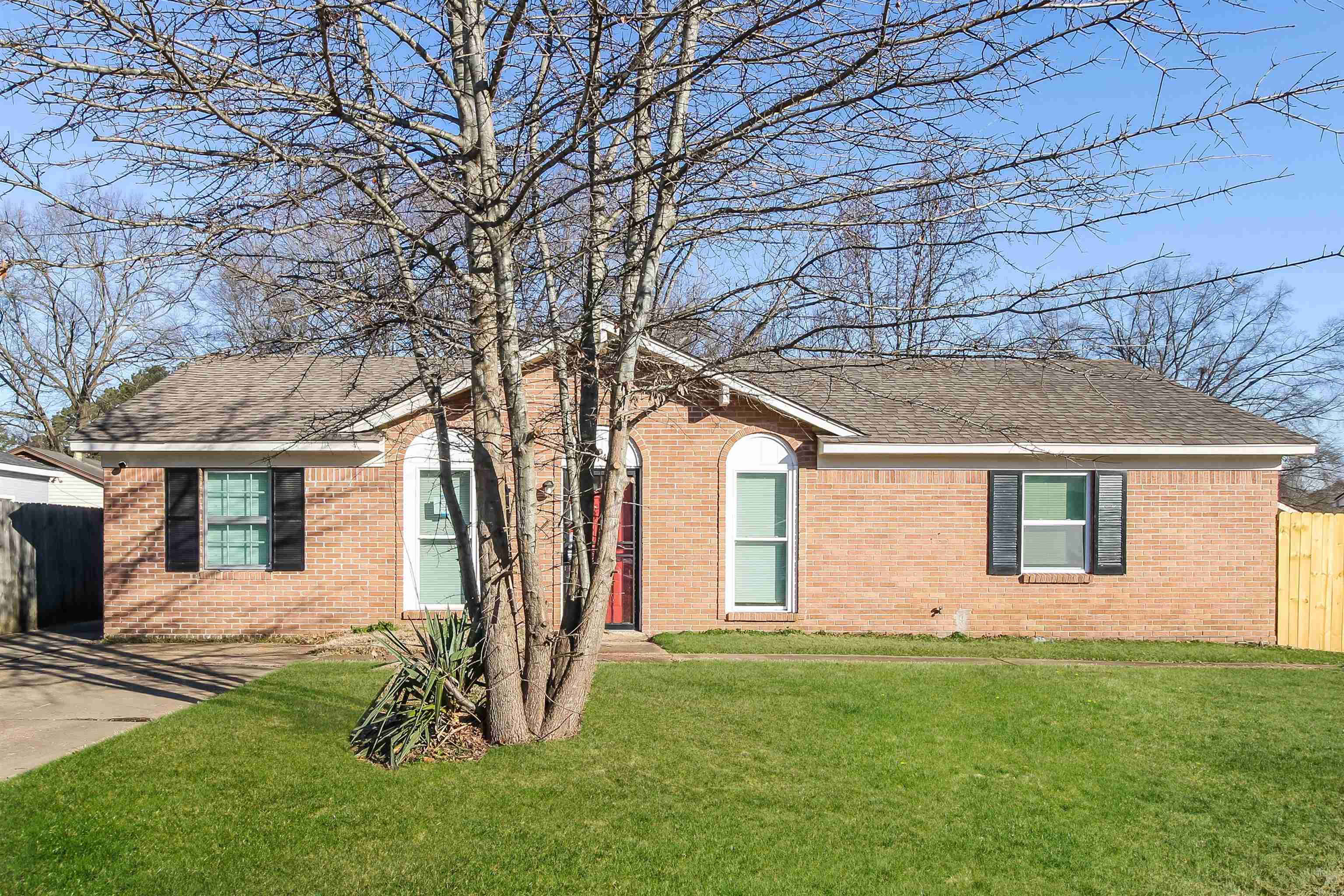 4014 Stowe Street Memphis, TN 38128 - Photo 1 of 16 front view of house with a yard