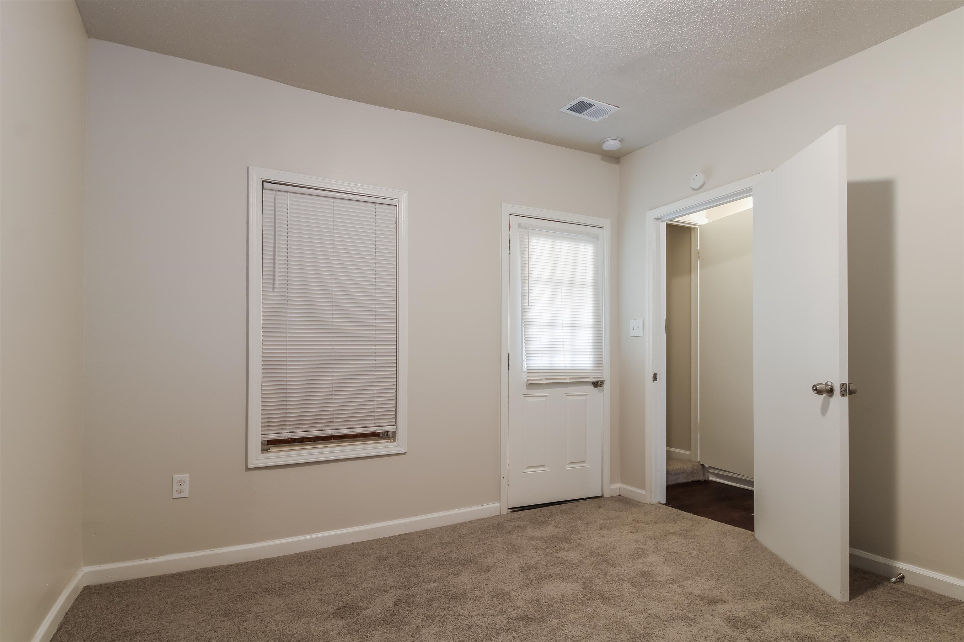4014 Stowe Street Memphis, TN 38128 - Photo 10 of 16 an empty room with windows