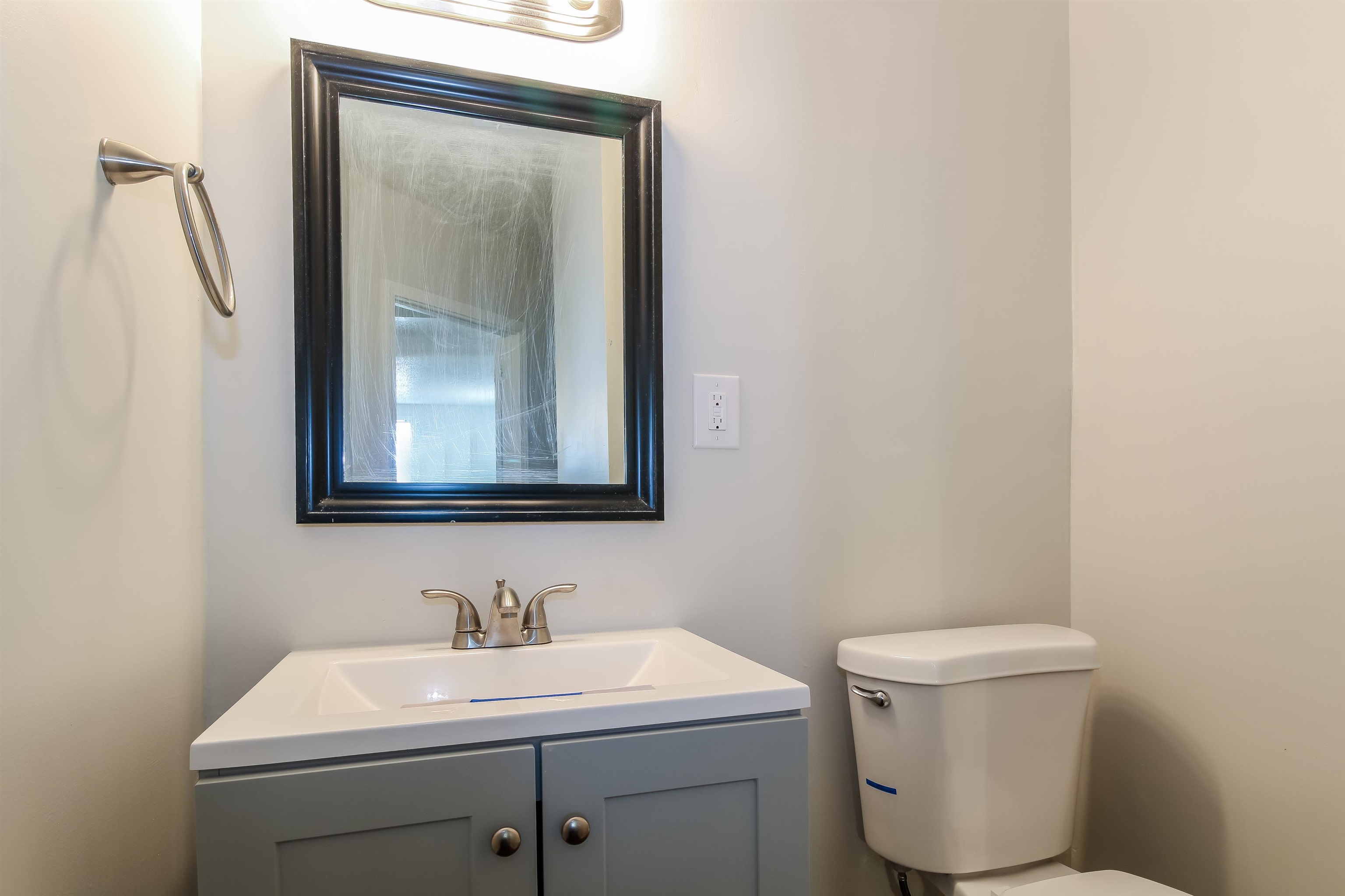 4014 Stowe Street Memphis, TN 38128 - Photo 12 of 16 a bathroom with a toilet a sink and mirror