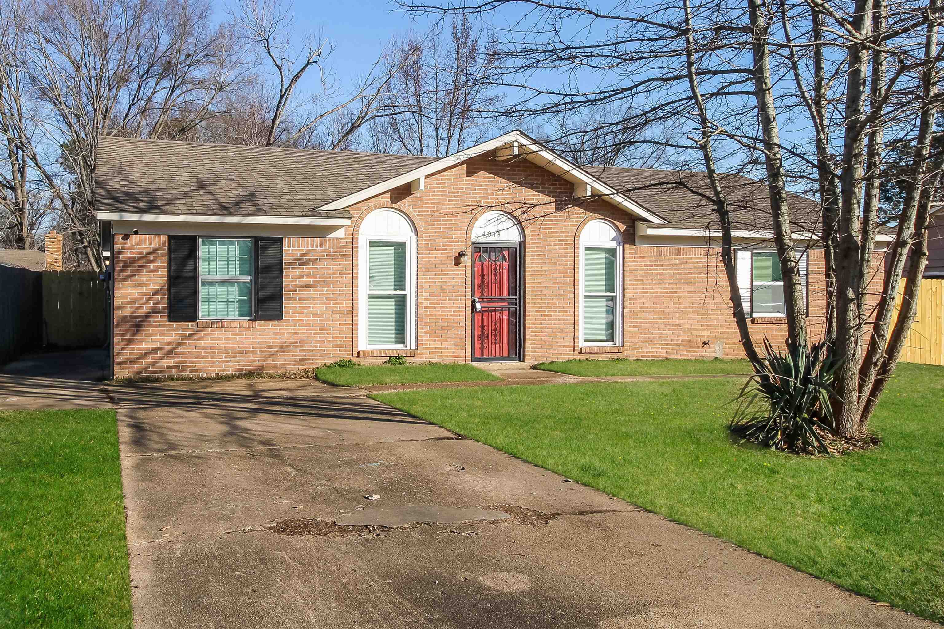 4014 Stowe Street Memphis, TN 38128 - Photo 3 of 16 a front view of a house with garden