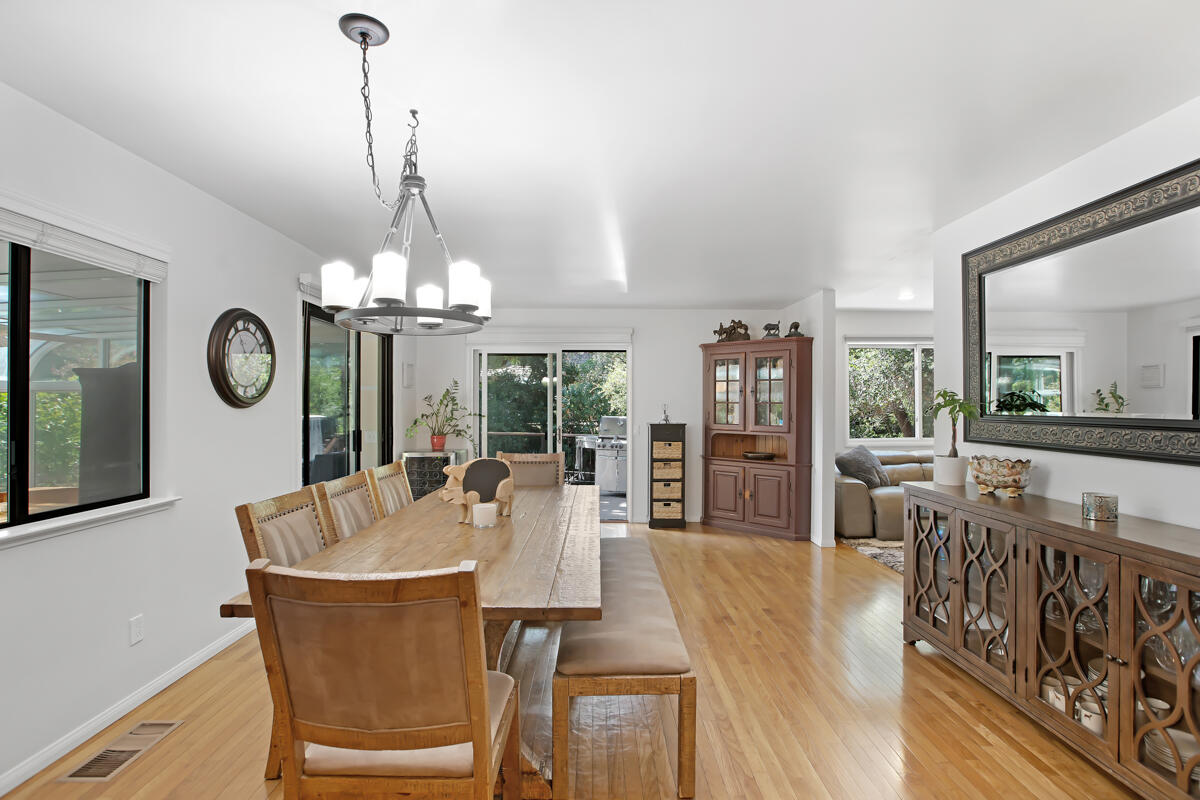 4009 Primavera Road Santa Barbara, CA 93110 - Photo 13 of 41 a view of a dining room with furniture window and wooden floor