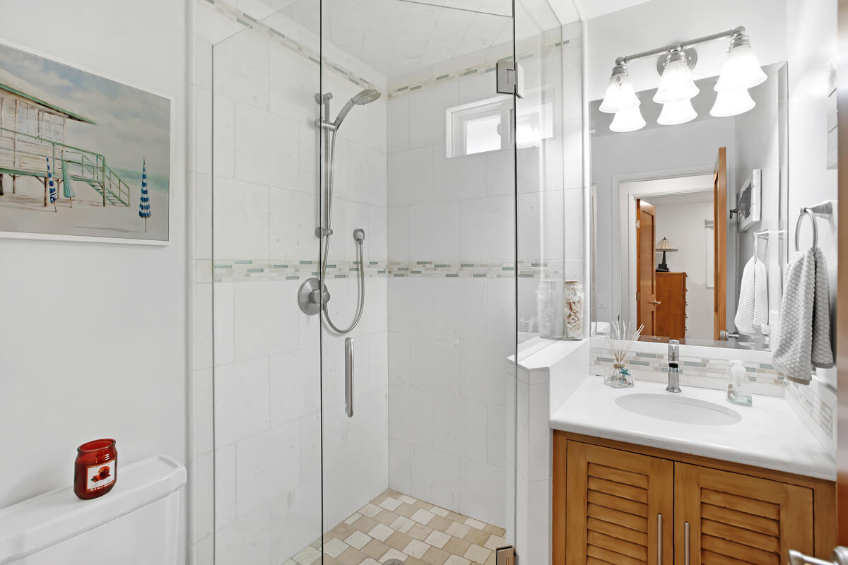 4009 Primavera Road Santa Barbara, CA 93110 - Photo 23 of 41 a bathroom with a sink vanity and shower