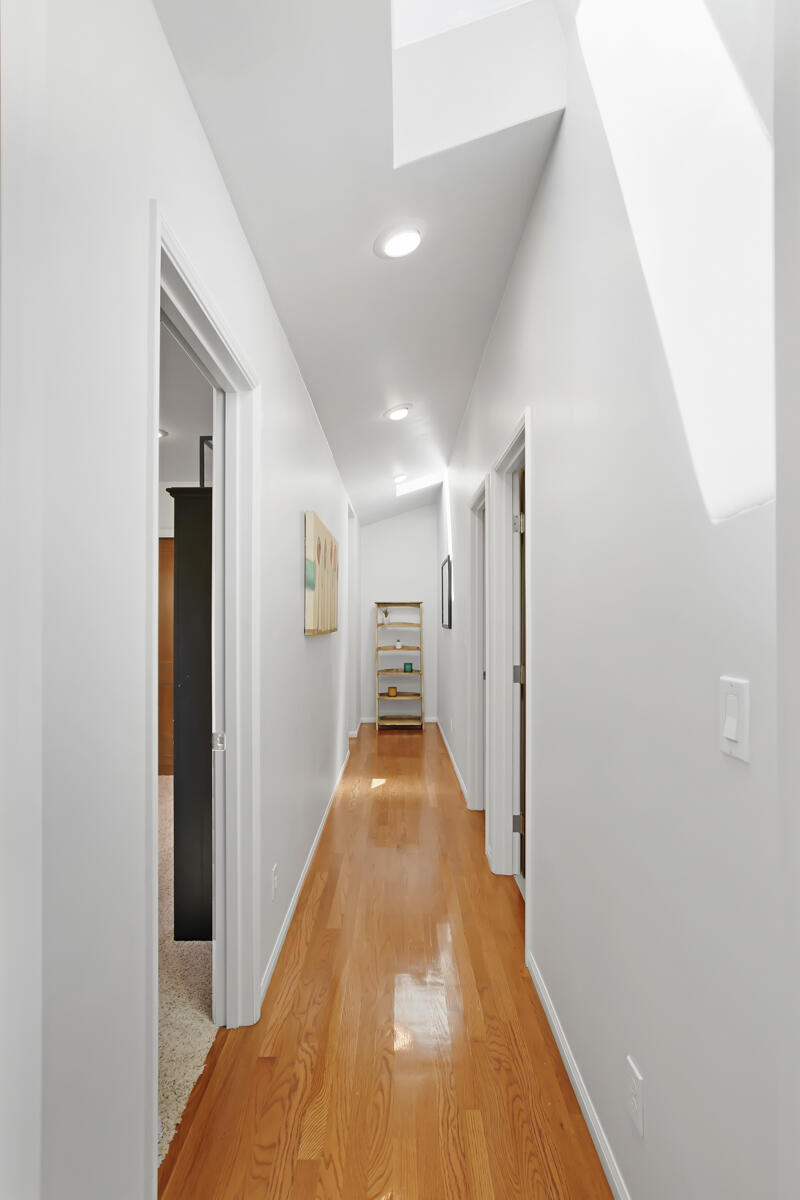 4009 Primavera Road Santa Barbara, CA 93110 - Photo 24 of 41 a view of a hallway with wooden floor