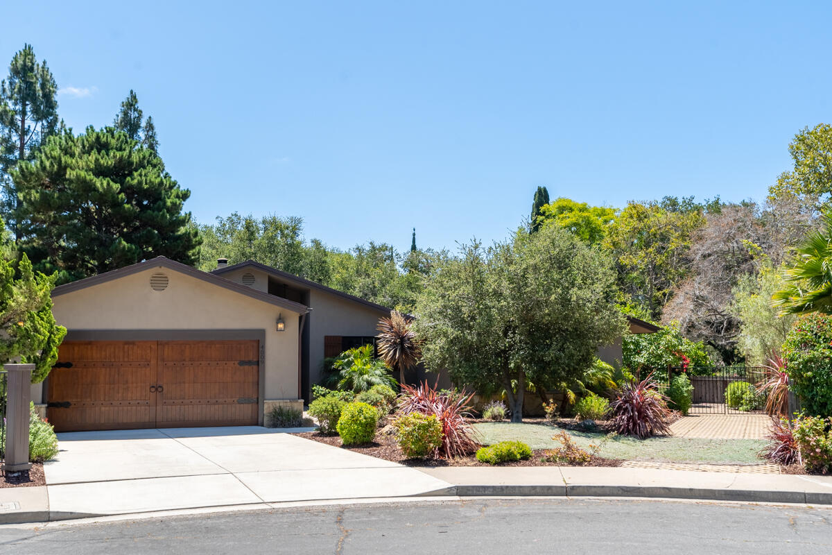 4009 Primavera Road Santa Barbara, CA 93110 - Photo 3 of 41 a front view of a house with a garden
