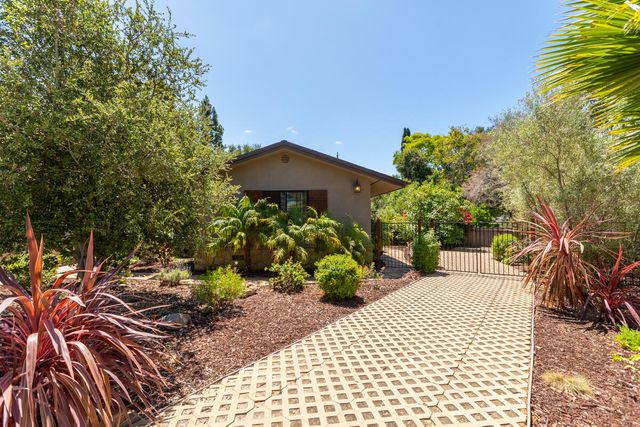 a view of a pathway with a bench