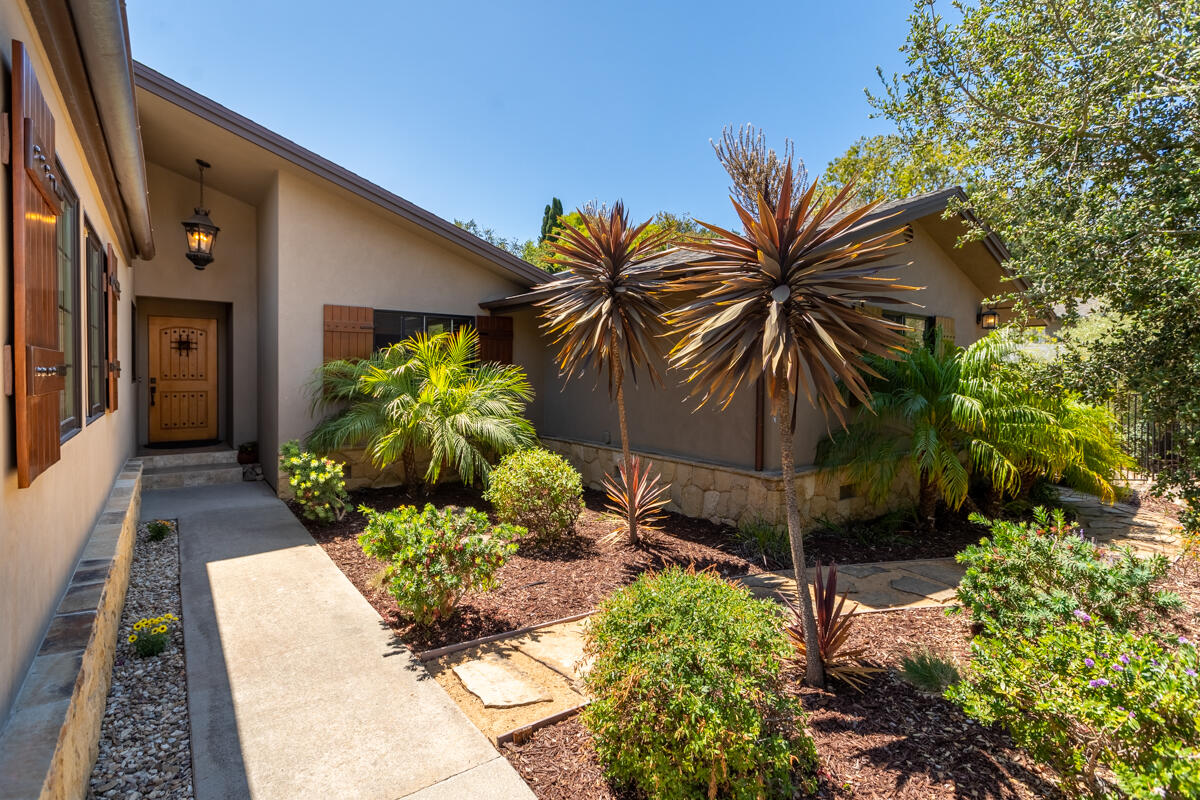 4009 Primavera Road Santa Barbara, CA 93110 - Photo 6 of 41 a potted plant sitting in front of a house