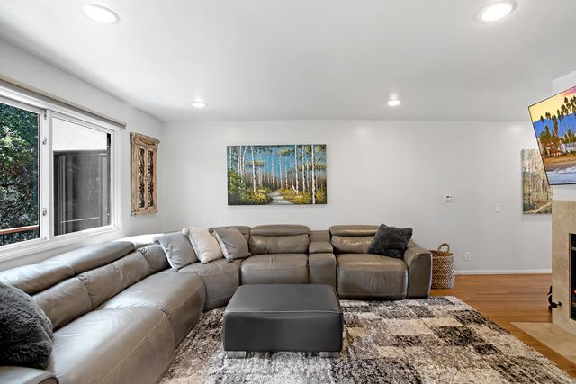 a living room with furniture and a rug