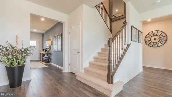 a view of entryway with wooden floor