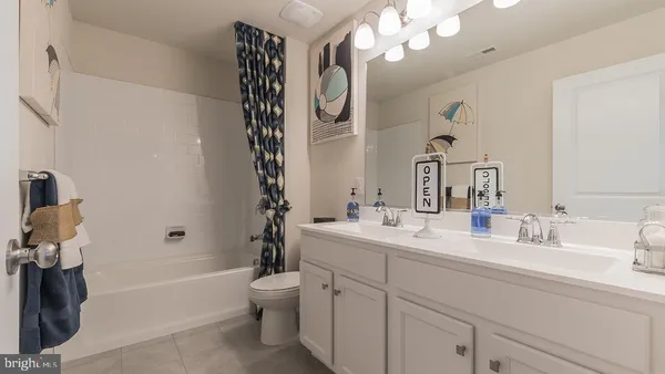 a bathroom with a sink a toilet and a bathtub