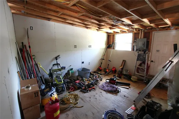 an aerial view of a house with a yard and garden