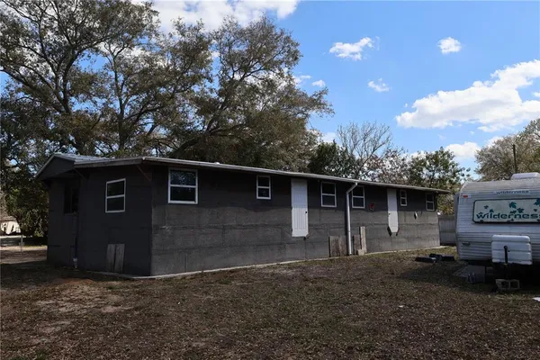 a front view of a house with yard