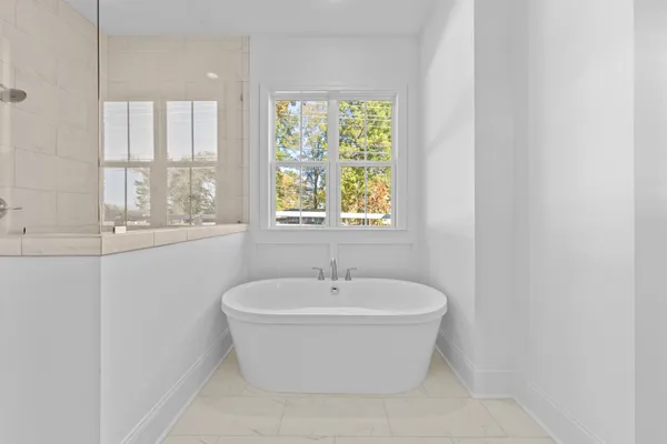 a bedroom with a large bed and a couch