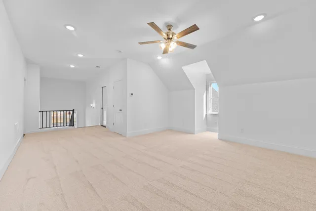 a view of an empty room with a fan