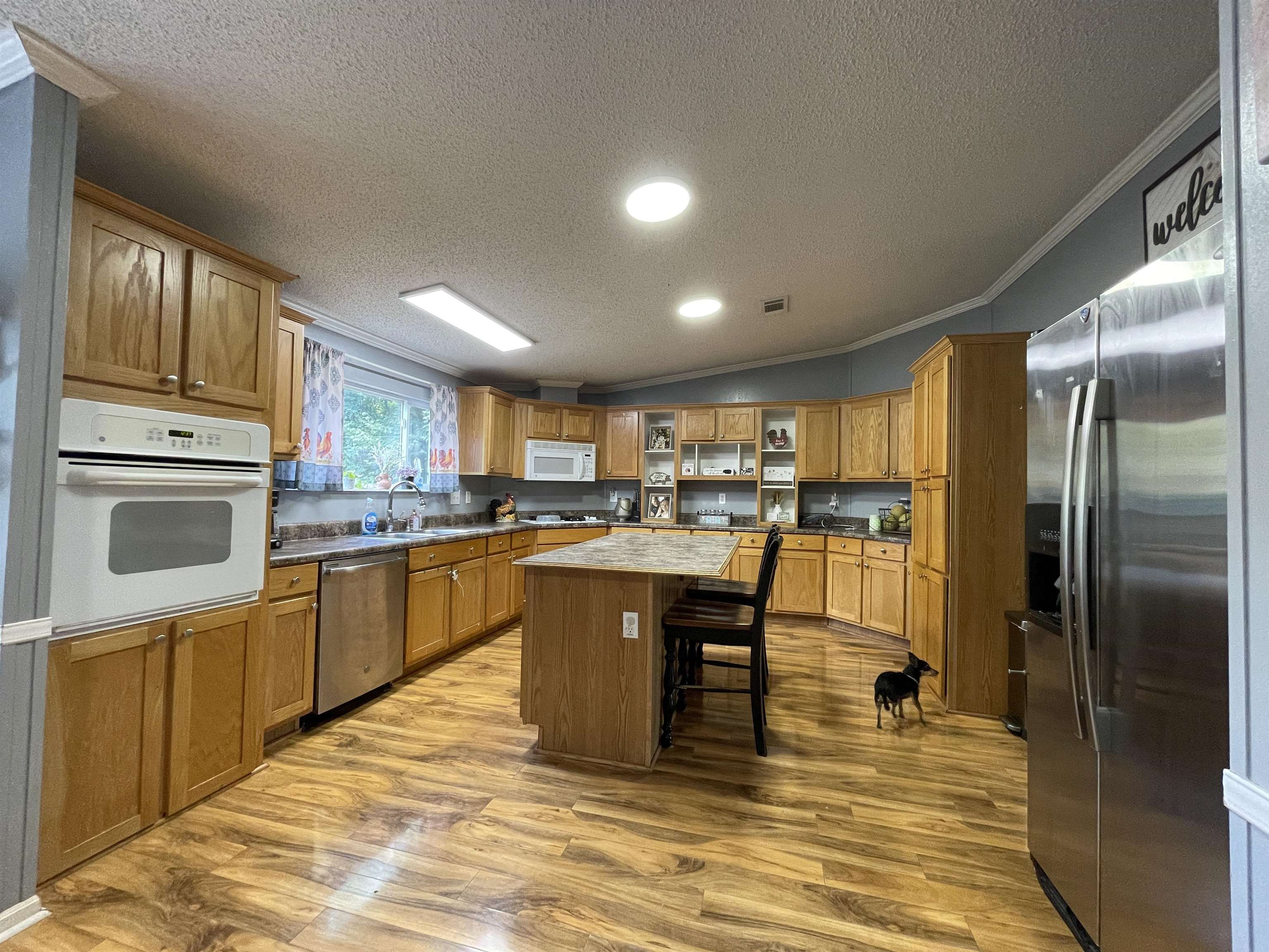 762 Pisgah Road Brighton, TN 38011 - Photo 5 of 19 Kitchen with a kitchen island, crown molding, and light wood-type flooring