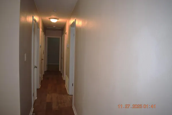 a view of a hallway with lamp