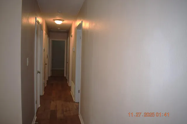 a view of a hallway with lamp